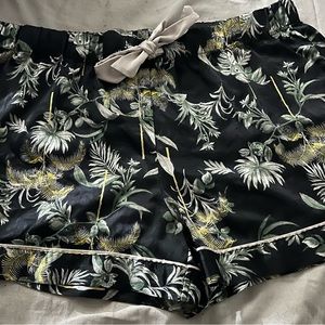 Victoria’s Secret woman’s silk pajama shorts in black with Tropical leaf pattern